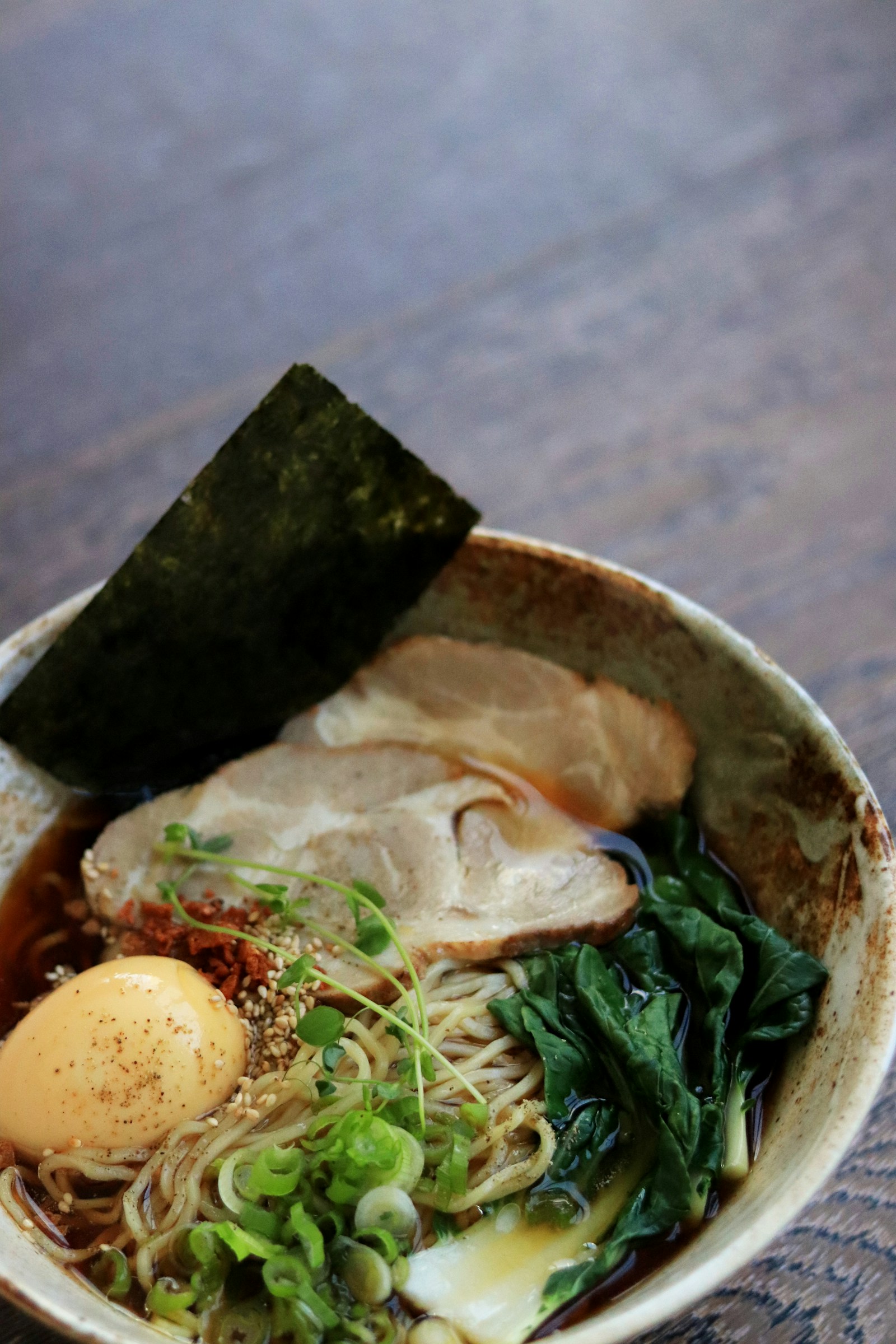 Warm noodle soup in a white bowl