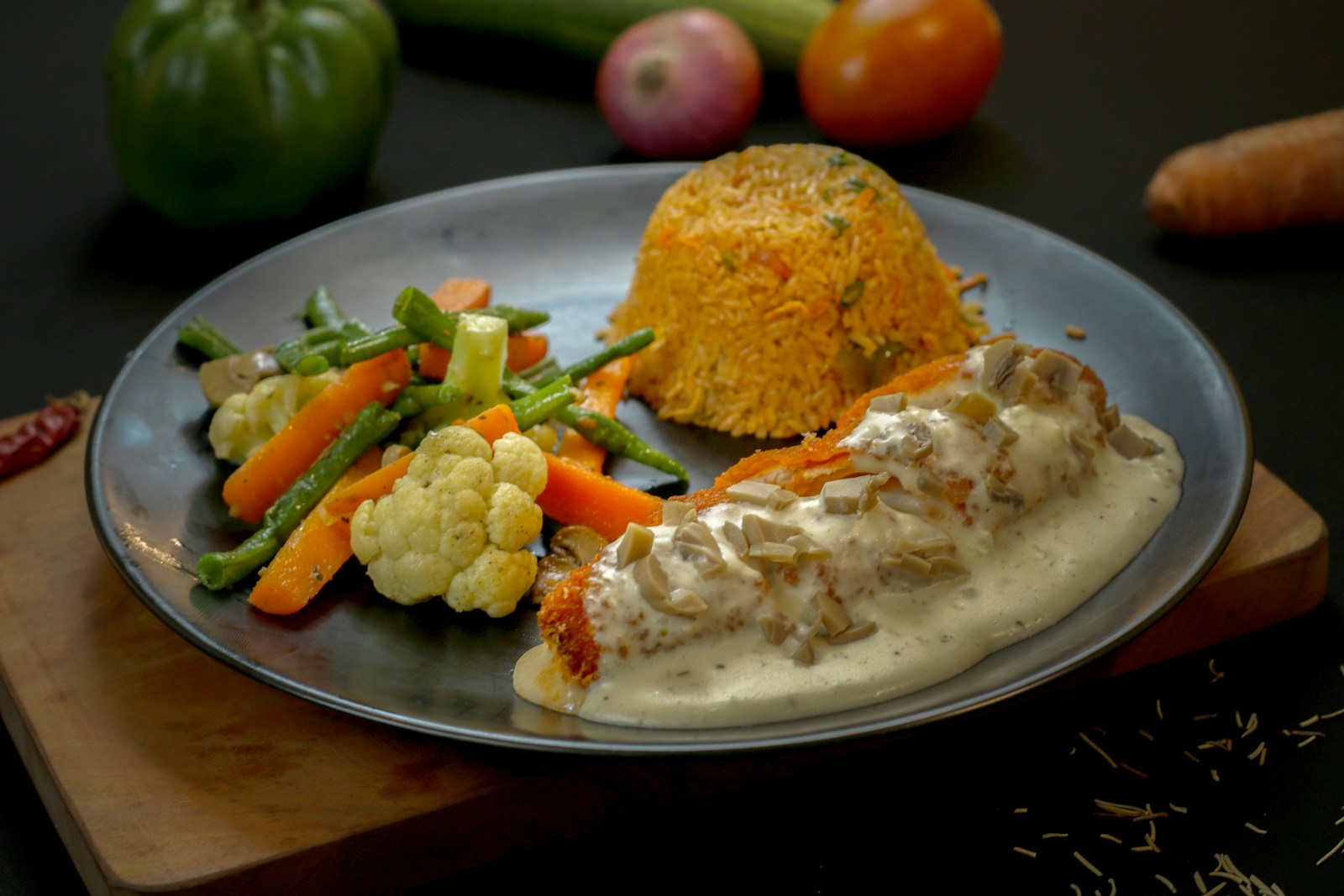 Creamy garlic chicken dinner with rice and vegetables