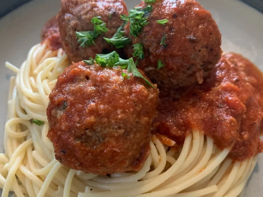 Easy Slow Cooker Mozzarella-Stuffed Meatballs And Sauce, freshly made and ready to serve